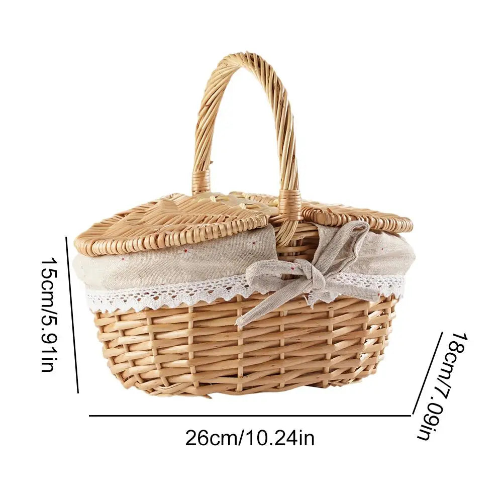 Wicker picnic basket with a lid and handle, featuring dimensions on a white background.
