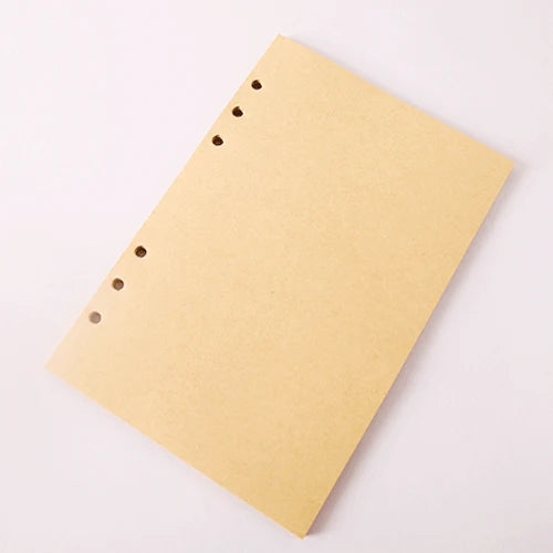 Beige notebook with holes on a white background