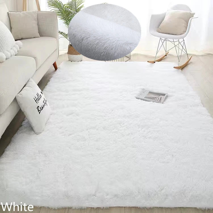 White fluffy rug in a living room setting with a sofa, chair, and decorative items.