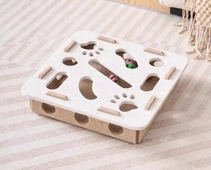 White and beige puzzle toy on a striped surface