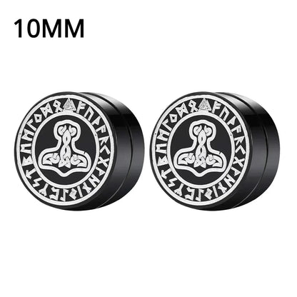 Pair of black and silver earrings withRunes on a white background